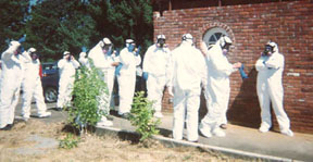 Employees in full gear for preparing for mold remediation on a stachybotrys infected home.